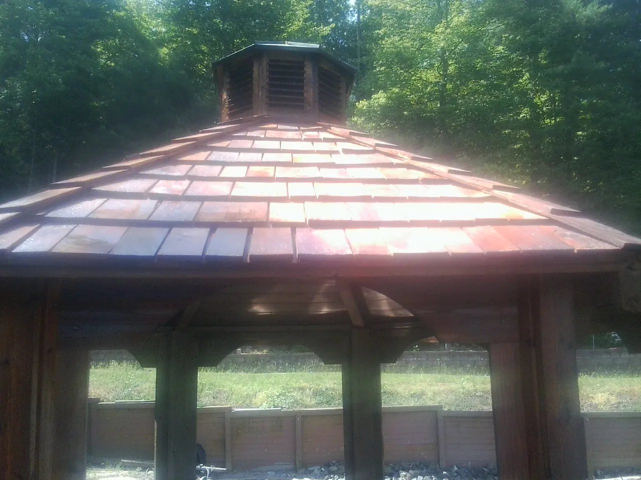 New cedar shake roof and cupola on a lakeside gazebo in Larkspur